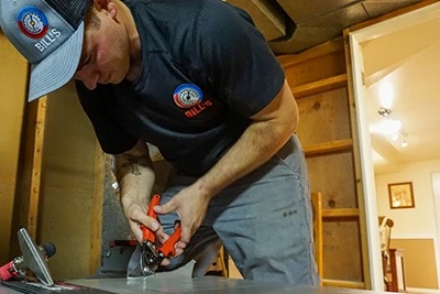 Bill’s Heating installer working on a furnace installation